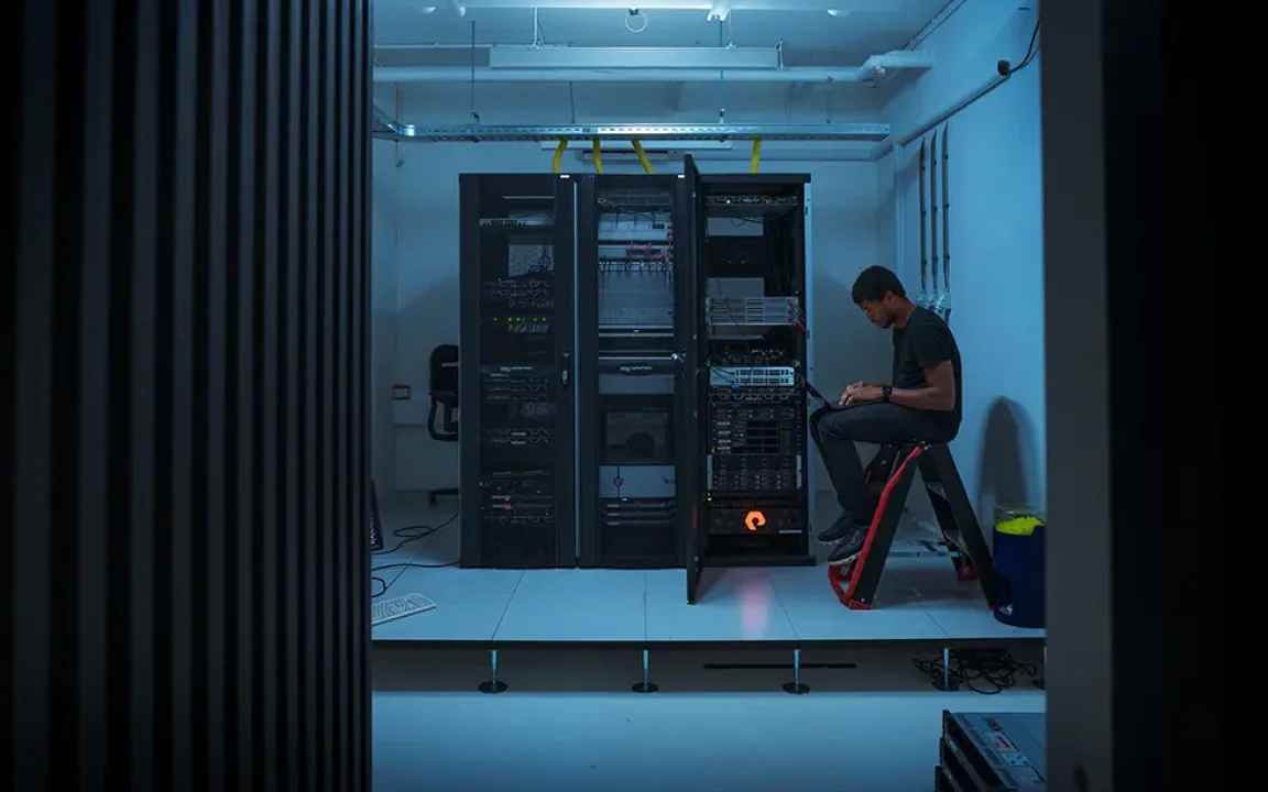 Colleague working in server space